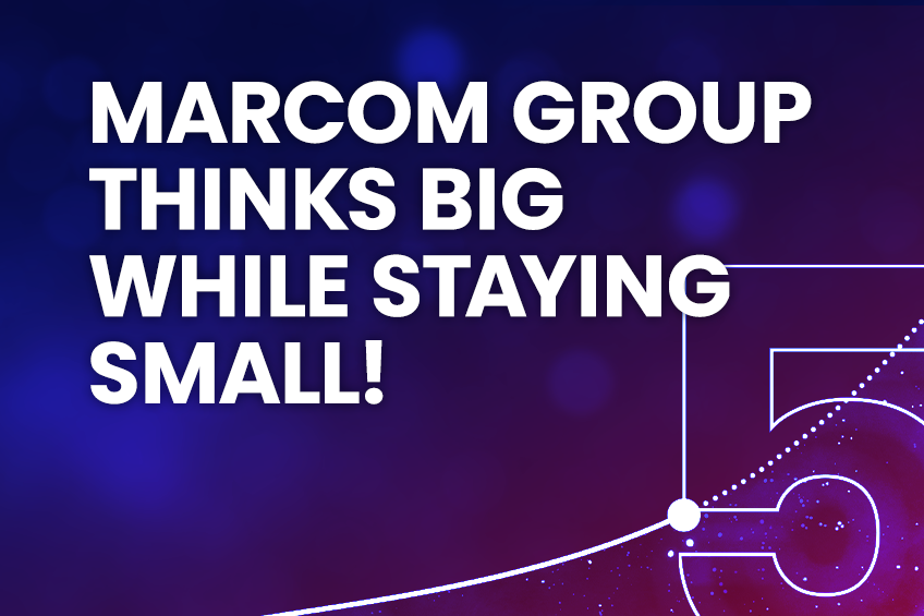 MarCom Group graphic featuring the text 'MarCom Group thinks big while staying small!' in bold white letters on a blue and red gradient space-like background with a glowing outline of the number 5.