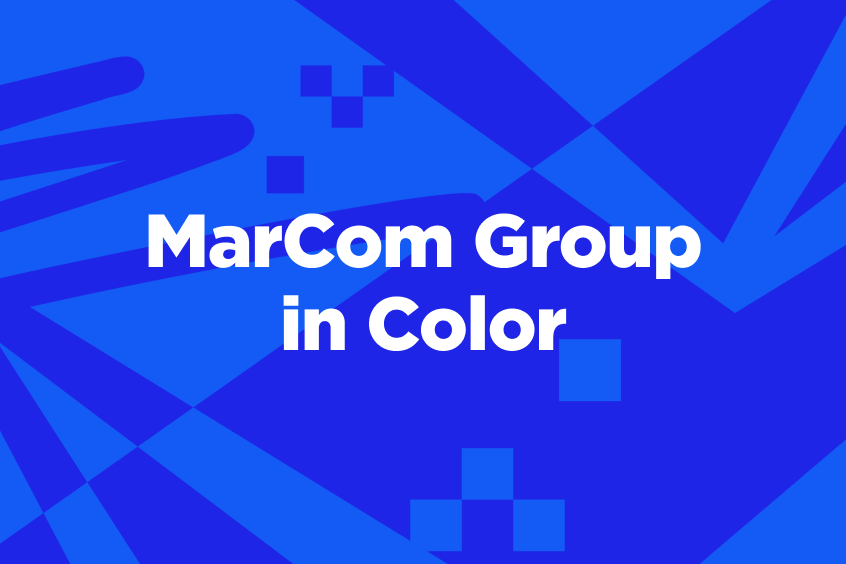 Text reads “MarCom Group in Color” on a vibrant blue geometric background with abstract patterns and shapes.
