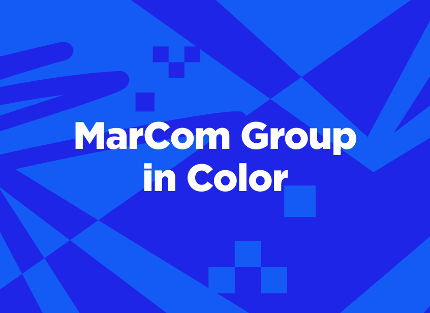 Text reads “MarCom Group in Color” on a vibrant blue geometric background with abstract patterns and shapes.