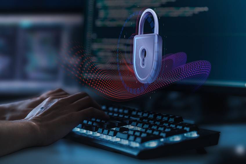 Cybersecurity-themed graphic showing hands typing on a keyboard with a digital lock and data wave overlay.